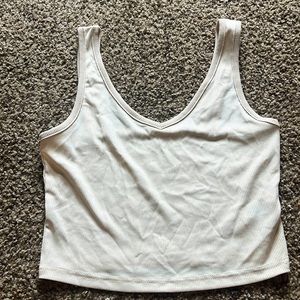 Tan colored cropped tank for teens.